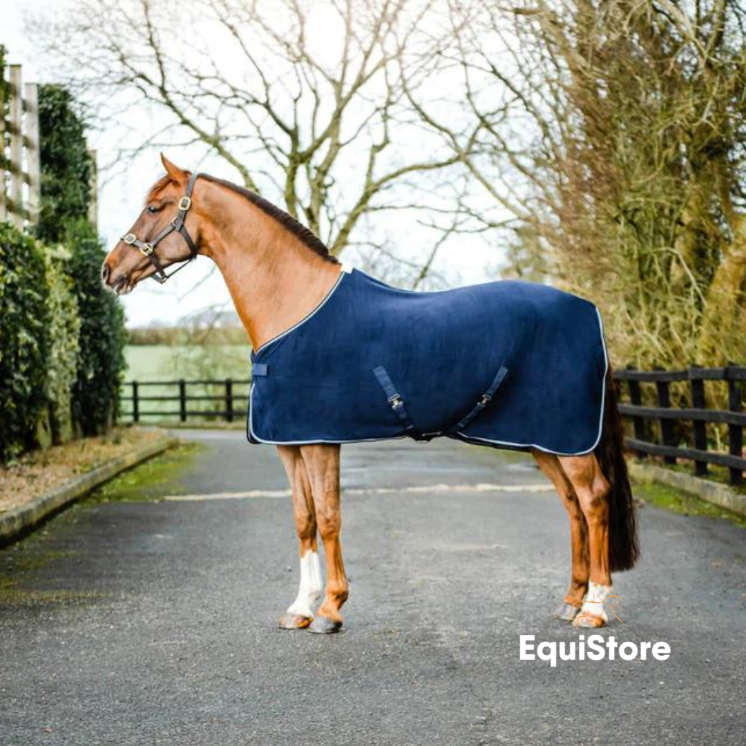EquiSential NEW Fleece Cooler, a travelling rug for horses, in navy with silver trim.